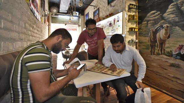 The growing number of visitors from the Middle East has also given rise to the demand for translators or interpreters. “ We escort them everywhere from hospitals to shopping to sightseeing. I directly get business from the Arabian countries,” says Riazuddin (R), an interpreter, at a restaurant called Middle East Cuisine in Jasola. His client, Mohammad Ashoor is from Iraq. (Burhaan Kinu / HT Photo)