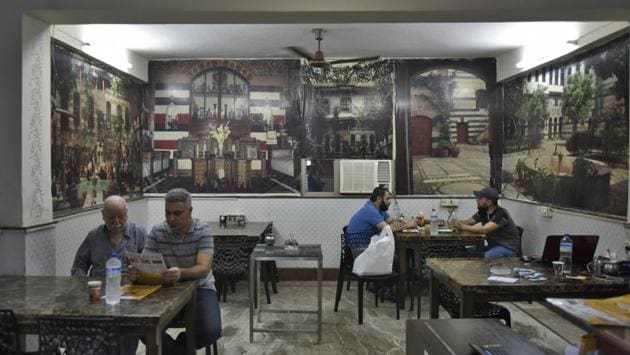 Familiarity breeds business for the establishments here since the Arabic ambience attracts customers as far as Gurugram. While medical tourists constitute a majority of the Ya Mal Alsham’s patrons, it also attracts Arab diplomats, students, and expats. The founder, Abdullah, a chef, came to India in 2012 as a refugee with his family. The restaurant’s walls have large posters of his restaurant and his house in Damascus. (Burhaan Kinu / HT Photo)
