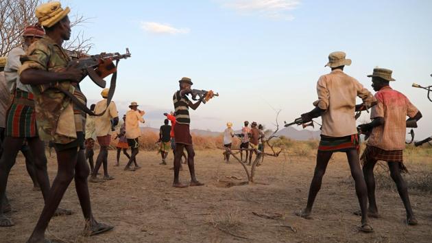 Turkana warriors after finding out that Nyangatom warriors are nearby. Mawien Makol, a spokesman for South Sudan’s Foreign Ministry said the work might be finished by the end of the year. Irene Akao Agum, a spokeswoman for Kenya’s Attorney General’s Office, said authorities were trying to gather information from both communities. The Turkana want to stay in Kenya, but these days in the Ilemi Triangle, there is little peace. (Goran Tomasevic / REUTERS) Turkana warriors after finding out that Nyangatom warriors are nearby. Mawien Makol, a spokesman for South Sudan’s Foreign Ministry said the work might be finished by the end of the year. Irene Akao Agum, a spokeswoman for Kenya’s Attorney General’s Office, said authorities were trying to gather information from both communities. The Turkana want to stay in Kenya, but these days in the Ilemi Triangle, there is little peace. (Goran Tomasevic / REUTERS)