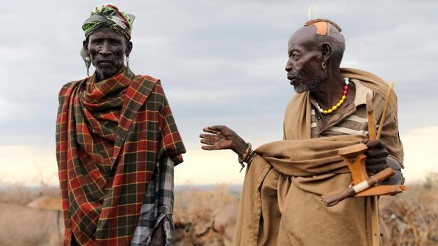 Elderly men talk at a settlement in Ilemi Triangle. One day a shaman came to read the entrails of a goat. He predicted rain and fighting. The rain came, but no fighting. Instead, news trickled in over scratchy phone lines that the group the men thought were targeting them had attacked another community nearby, carrying off around 600 animals. Reuters could not independently verify the incident. (Goran Tomasevic / REUTERS) Elderly men talk at a settlement in Ilemi Triangle. One day a shaman came to read the entrails of a goat. He predicted rain and fighting. The rain came, but no fighting. Instead, news trickled in over scratchy phone lines that the group the men thought were targeting them had attacked another community nearby, carrying off around 600 animals. Reuters could not independently verify the incident. (Goran Tomasevic / REUTERS)