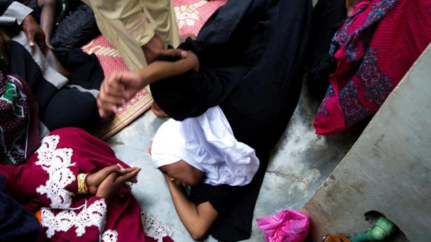 A sheikh at the Shifaa Herbal clinic holds onto a woman who is treated for what she believes is possession by supernatural sprits like djinns, in Zanzibar City, Tanzania. There are more healers, or mgangas, from the ones already accounted for hoping to register, said Hassan Combo, the government registrar at the council that records them. (Nichky Woo / REUTERS) A sheikh at the Shifaa Herbal clinic holds onto a woman who is treated for what she believes is possession by supernatural sprits like djinns, in Zanzibar City, Tanzania. There are more healers, or mgangas, from the ones already accounted for hoping to register, said Hassan Combo, the government registrar at the council that records them. (Nichky Woo / REUTERS)