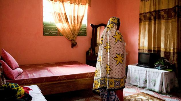 Bi Mwanahija Mzee prays in her bedroom. Her parents were also traditional healers in Zanzibar, an archipelago in the Indian Ocean. To be registered, mgangas must be aged at least 18, have at least three years of experience and have a recommendation letter from a trained mganga. A council of 11 members that can include birth attendants, respected healers, village elders and lawyers approve the applications each month. (Nicky Woo / REUTERS) Bi Mwanahija Mzee prays in her bedroom. Her parents were also traditional healers in Zanzibar, an archipelago in the Indian Ocean. To be registered, mgangas must be aged at least 18, have at least three years of experience and have a recommendation letter from a trained mganga. A council of 11 members that can include birth attendants, respected healers, village elders and lawyers approve the applications each month. (Nicky Woo / REUTERS)