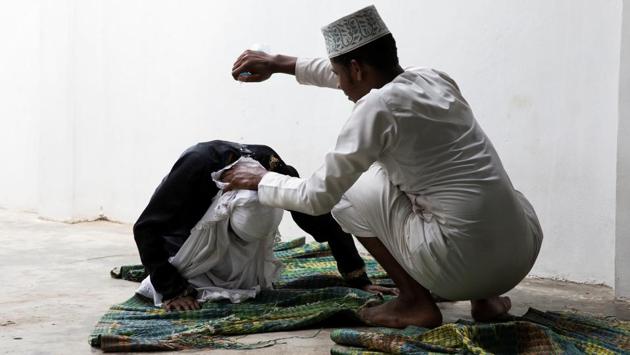A sheikh tries to rouse a woman by pouring water on her neck in Zanzibar City. The woman believes she is possessed by supernatural spirits like djinns. A group facilitated by the registrars office links doctors with traditional healers to give them some medical education on specific diseases like hypertension, diabetes and pregnancy. The mgangas share information with the doctors about patient statistics and needs, he said. (Nicky Woo / REUTERS) A sheikh tries to rouse a woman by pouring water on her neck in Zanzibar City. The woman believes she is possessed by supernatural spirits like djinns. A group facilitated by the registrars office links doctors with traditional healers to give them some medical education on specific diseases like hypertension, diabetes and pregnancy. The mgangas share information with the doctors about patient statistics and needs, he said. (Nicky Woo / REUTERS)