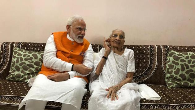 Prime Minister Narendra Modi meets his mother on his 69th birthday (BJP/Twitter) Prime Minister Narendra Modi meets his mother on his 69th birthday (BJP/Twitter)
