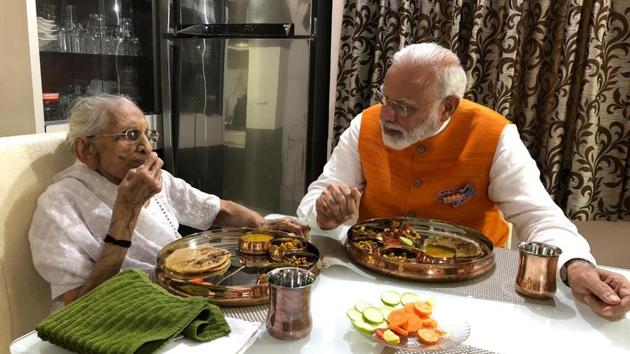 PM Modi meets his mother Heeraben Modi (BJP/Twitter) PM Modi meets his mother Heeraben Modi (BJP/Twitter)