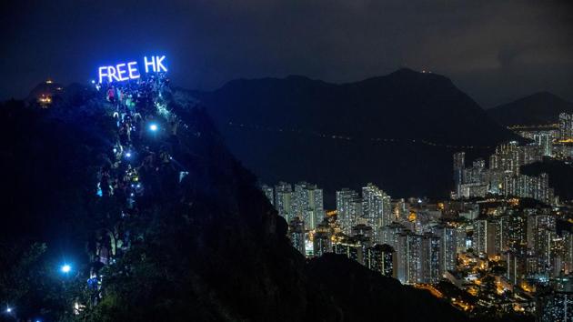 Anti-government protesters gather at Lion Rock, in Hong Kong on September 13, 2019. The movement, largely leaderless has continued since the bill’s withdrawal with several new demands emerging. These chiefly include the withdrawal of the term ‘riot’ for the protests, amnesty for participants, universal suffrage in choosing the territory’s leader and even Carrie Lam’s resignation in some quarters. (Athit Perawongmetha / REUTERS) Anti-government protesters gather at Lion Rock, in Hong Kong on September 13, 2019. The movement, largely leaderless has continued since the bill’s withdrawal with several new demands emerging. These chiefly include the withdrawal of the term ‘riot’ for the protests, amnesty for participants, universal suffrage in choosing the territory’s leader and even Carrie Lam’s resignation in some quarters. (Athit Perawongmetha / REUTERS)