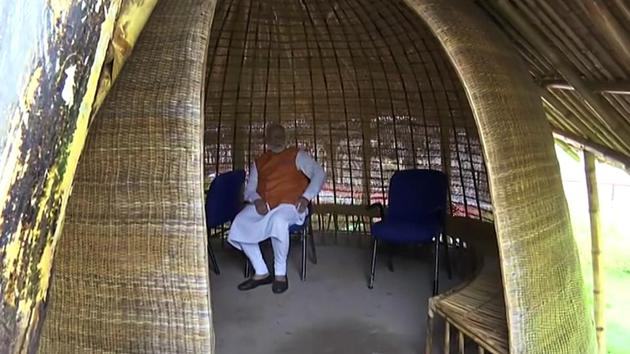 Prime Minister Narendra Modi sitting in a hut during his visit to Kevadia in Narmada (ANI PHOTO) Prime Minister Narendra Modi sitting in a hut during his visit to Kevadia in Narmada (ANI PHOTO)