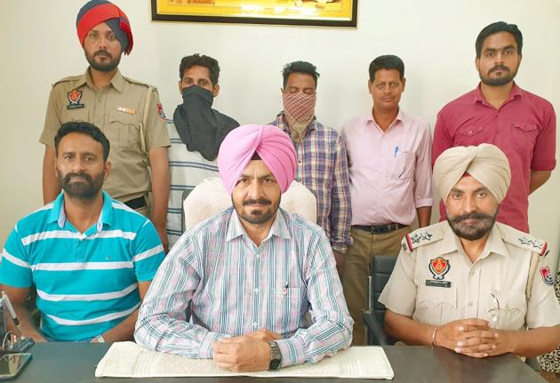 STF officials with the accused( faces covered) addressing media persons in Ludhiana on Tuesday. (HT Photo) STF officials with the accused( faces covered) addressing media persons in Ludhiana on Tuesday. (HT Photo)