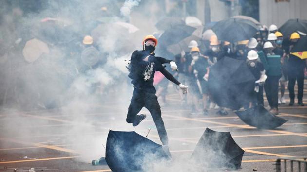 Yuen Long saw another protest comprising thousands on July 27, condemning the station attack by suspected triad member s who beat up pro-democracy demonstrators there last weekend. Riot police responded by firing tear gas on those gathered, deeming it an unauthorised protest. (Anthony Wallace / AFP) Yuen Long saw another protest comprising thousands on July 27, condemning the station attack by suspected triad member s who beat up pro-democracy demonstrators there last weekend. Riot police responded by firing tear gas on those gathered, deeming it an unauthorised protest. (Anthony Wallace / AFP)
