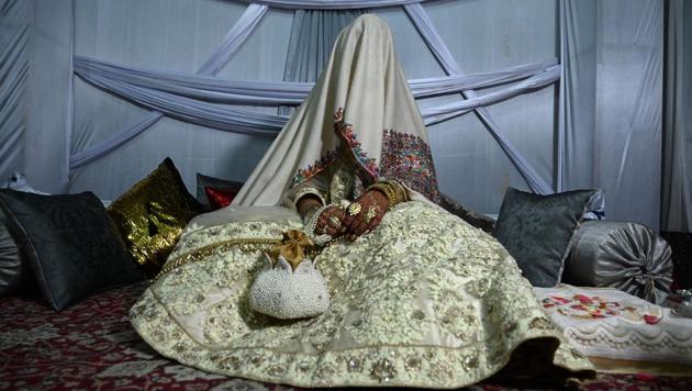 A bride sits in her husband’s home following their marriage in Kashmir’s Baramulla. After a year-long countdown, Arshi Nisar’s wedding plans are in tatters, the Kashmiri bride-to-be fearing for her guests’ safety as a security and communications clampdown leaves residents on edge. Like thousands of families in the region, she resigned to an austere event, with no more than 40 guests in attendance -- if they are able to venture out of their homes. (Tauseef Mustafa / AFP)
