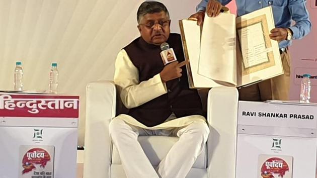 Union minister Ravi Shankar Prasad holds a copy of the original Constitution carrying paintings of Indian gods and rulers. He was speaking at Hindustan Purvoday summit in Ranchi, Jharkhand(HT Photo) Union minister Ravi Shankar Prasad holds a copy of the original Constitution carrying paintings of Indian gods and rulers. He was speaking at Hindustan Purvoday summit in Ranchi, Jharkhand(HT Photo)