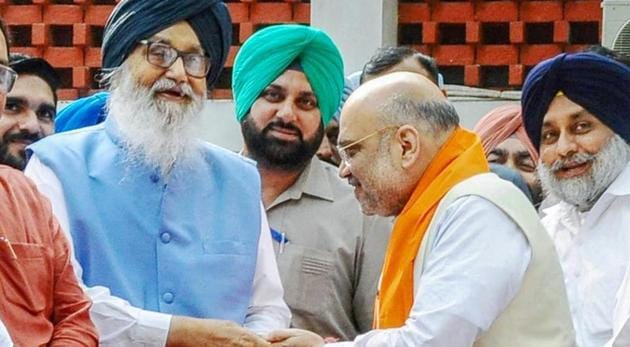 Fiile photo of BJP’s Amit Shah with Shiromani Akali Dal patriarch Parkash Singh Badal. The SAD will hold negotiations with the Bharatiya Janata Party on seat-sharing for Haryana assembly polls. (PTI file) Fiile photo of BJP’s Amit Shah with Shiromani Akali Dal patriarch Parkash Singh Badal. The SAD will hold negotiations with the Bharatiya Janata Party on seat-sharing for Haryana assembly polls. (PTI file)