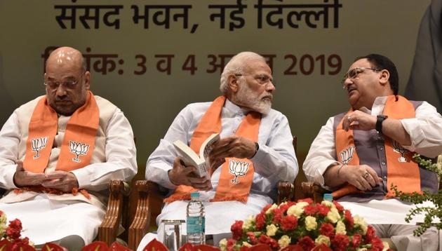 Prime Minister Narendra Modi in conversation with Union Home Minister Amit Shah, and BJP working President JP Nadda. (Sonu Mehta/HT PHOTO) Prime Minister Narendra Modi in conversation with Union Home Minister Amit Shah, and BJP working President JP Nadda. (Sonu Mehta/HT PHOTO)
