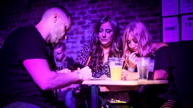 Customers play bingo at the 'Bongo's Bingo' event in Glasgow, Scotland. Flanked by two male colleagues dressed in drag, Kelly handed out prizes including cash, liquor and a cardboard cutout of a daytime TV personality, as the crowd danced to occasional blasts of cheesy pop hits. (Andy Buchanan / AFP) Customers play bingo at the 'Bongo's Bingo' event in Glasgow, Scotland. Flanked by two male colleagues dressed in drag, Kelly handed out prizes including cash, liquor and a cardboard cutout of a daytime TV personality, as the crowd danced to occasional blasts of cheesy pop hits. (Andy Buchanan / AFP)