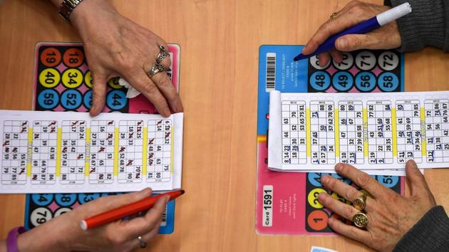 Customers face off during a run. Bingo is believed to have originated in Italy in the 16th century, spreading to other countries and beyond over the centuries. It had its heyday in Britain in the 1960s but its popularity continues in places, none more so than in Glasgow. At least 14 clubs remain across Scotland’s biggest city and its suburbs, more than anywhere else in Britain, according to The Bingo Association. (Andy Buchanan / AFP) Customers face off during a run. Bingo is believed to have originated in Italy in the 16th century, spreading to other countries and beyond over the centuries. It had its heyday in Britain in the 1960s but its popularity continues in places, none more so than in Glasgow. At least 14 clubs remain across Scotland’s biggest city and its suburbs, more than anywhere else in Britain, according to The Bingo Association. (Andy Buchanan / AFP)