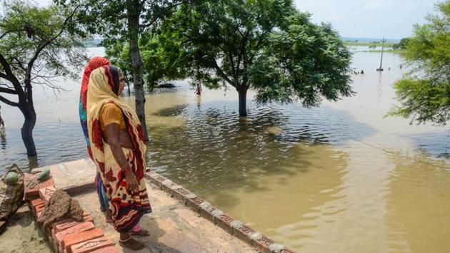 A woman look on at a flooded area following heavy monsoon rain in Mirzapur district of Uttar Pradesh. Continued rainfall in the Bundelkhand region and release of water in Yamuna had led to flooding in many areas in Hamirpur, Banda and Chitrakoot districts. Yamuna, Ken and Betwa rivers are in spate and several acres of agricultural land has been submerged, a report said. (PTI) A woman look on at a flooded area following heavy monsoon rain in Mirzapur district of Uttar Pradesh. Continued rainfall in the Bundelkhand region and release of water in Yamuna had led to flooding in many areas in Hamirpur, Banda and Chitrakoot districts. Yamuna, Ken and Betwa rivers are in spate and several acres of agricultural land has been submerged, a report said. (PTI)