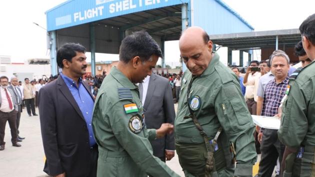 Rajnath Singh being prepared to fly on ‘Tejas’, an Indigenous Light Combat Aircraft from Bengaluru’s HAL Airport. (TWITTER: @rajnathsingh) Rajnath Singh being prepared to fly on ‘Tejas’, an Indigenous Light Combat Aircraft from Bengaluru’s HAL Airport. (TWITTER: @rajnathsingh)