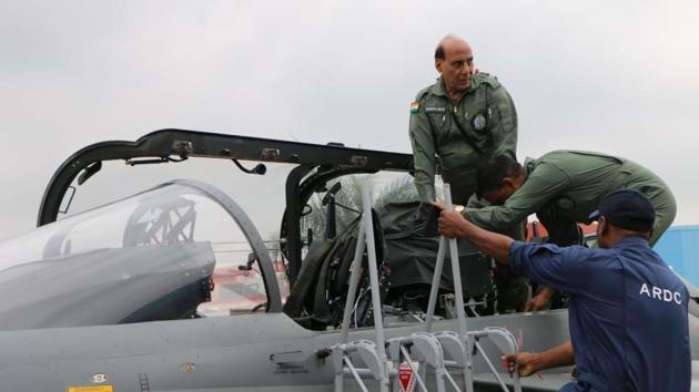 Rajnath Singh being prepared to fly on ‘Tejas’, an Indigenous Light Combat Aircraft from Bengaluru’s HAL Airport. (TWITTER: @rajnathsingh) Rajnath Singh being prepared to fly on ‘Tejas’, an Indigenous Light Combat Aircraft from Bengaluru’s HAL Airport. (TWITTER: @rajnathsingh)