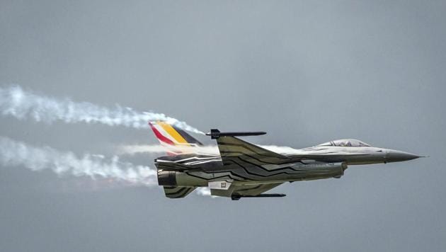 A Belgian F-16 fighter jet crashed Thursday, Sept. 19, 2019 on a road in western France and one of its pilots is hanging from a high-voltage electricity line after his parachute got caught, according to French authorities. (AP Photo) A Belgian F-16 fighter jet crashed Thursday, Sept. 19, 2019 on a road in western France and one of its pilots is hanging from a high-voltage electricity line after his parachute got caught, according to French authorities. (AP Photo)
