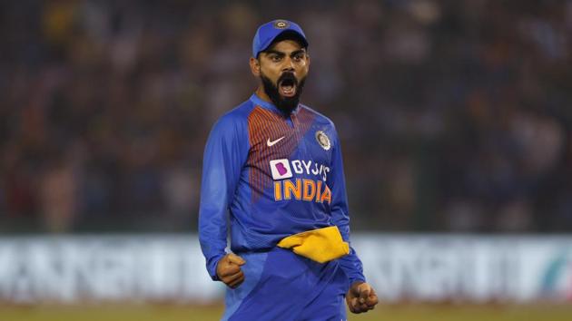 India's captain Virat Kohli reacts after taking a catch to dismiss South Africa's captain Quinton de Kock during the second T20 international match between India and South Africa, in Mohali, India, Wednesday.(AP)