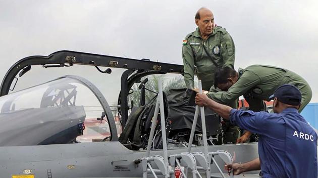 Defence Minister Rajnath Singh prepares to fly in the Tejas fighter aircraft from the HAL airport in Bengaluru. (PTI Photo) Defence Minister Rajnath Singh prepares to fly in the Tejas fighter aircraft from the HAL airport in Bengaluru. (PTI Photo)