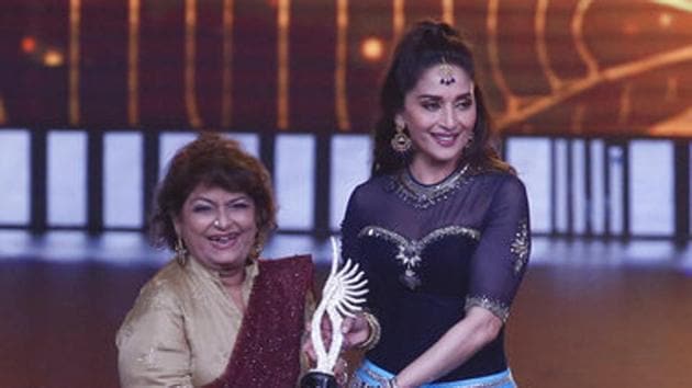 Bollywood actress Madhuri Dixit, right, presents a special award to Indian choreographer Saroj Khan. (AP) Bollywood actress Madhuri Dixit, right, presents a special award to Indian choreographer Saroj Khan. (AP)