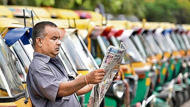 An auto-rickshaw driver reads a news paper during a strike by United Front of Transport Association (UFTA) against various provisions of the amended Motor Vehicle (MV) Act, in New Delhi (Biplov Bhuyan / Hindustan Times) An auto-rickshaw driver reads a news paper during a strike by United Front of Transport Association (UFTA) against various provisions of the amended Motor Vehicle (MV) Act, in New Delhi (Biplov Bhuyan / Hindustan Times)