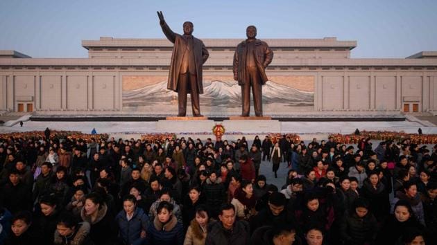 An image of Mount Paektu displayed behind the statues ofKim Il Sung and Kim Jong Il, as people pay their respects in Pyongyang. “The guerrilla fighters shed tears from pity that our general -- only a few months old -- had so little to eat and brought back food and goat milk.” The story has several echoes of the Christian Nativity, from a bright star shining in the sky, a birth in adversity, and well-wishers bringing gifts. (Ed Jones / AFP) An image of Mount Paektu displayed behind the statues ofKim Il Sung and Kim Jong Il, as people pay their respects in Pyongyang. “The guerrilla fighters shed tears from pity that our general -- only a few months old -- had so little to eat and brought back food and goat milk.” The story has several echoes of the Christian Nativity, from a bright star shining in the sky, a birth in adversity, and well-wishers bringing gifts. (Ed Jones / AFP)