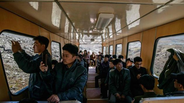 After the war the Mount Paektu camp was lost to the forests, the guide explained, but Kim Il Sung recognised its location on a visit in 1986 and had its three huts rebuilt to ensure younger generations could be taught about “our country that he has defended and won back with his blood”. “It is the ardent wish of all the people to visit the secret camp,” she added. (Ed Jones / AFP) After the war the Mount Paektu camp was lost to the forests, the guide explained, but Kim Il Sung recognised its location on a visit in 1986 and had its three huts rebuilt to ensure younger generations could be taught about “our country that he has defended and won back with his blood”. “It is the ardent wish of all the people to visit the secret camp,” she added. (Ed Jones / AFP)