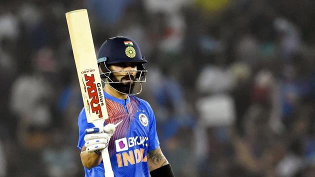 Indian captain Virat Kohli raises his bat after scoring fifty. (PTI) Indian captain Virat Kohli raises his bat after scoring fifty. (PTI)