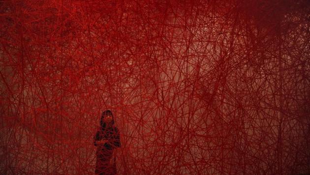 A woman looks at Chiharu Shiota’s art installation titled ‘Uncertain Journey’ at the Mori Art Museum in Tokyo, Japan. (Jae C. Hong / AP) A woman looks at Chiharu Shiota’s art installation titled ‘Uncertain Journey’ at the Mori Art Museum in Tokyo, Japan. (Jae C. Hong / AP)