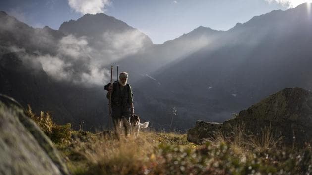 Hunter Peter Marugg and his dog, Fjura, look for chamois, in the second of the three-week-long hunting season in Klosters, Graubuenden, Switzerland. The 69-year old said he has been hunting since 1970. Hunting has a long standing tradition in the canton of Graubuenden, with approximately 5,500 practicing. (Gian Ehrenzeller / Keystone via AP) Hunter Peter Marugg and his dog, Fjura, look for chamois, in the second of the three-week-long hunting season in Klosters, Graubuenden, Switzerland. The 69-year old said he has been hunting since 1970. Hunting has a long standing tradition in the canton of Graubuenden, with approximately 5,500 practicing. (Gian Ehrenzeller / Keystone via AP)