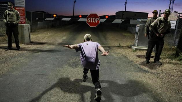 A man poses as if he is going to “Naruto run” at an entrance to Area 51 as an influx of tourists responds to a call to ‘storm’ Area 51, a secretive US military base believed by UFO enthusiasts to hold government secrets about extra-terrestrials, in Rachel, Nevada. (Jim Urquhart / REUTERS) A man poses as if he is going to “Naruto run” at an entrance to Area 51 as an influx of tourists responds to a call to ‘storm’ Area 51, a secretive US military base believed by UFO enthusiasts to hold government secrets about extra-terrestrials, in Rachel, Nevada. (Jim Urquhart / REUTERS)