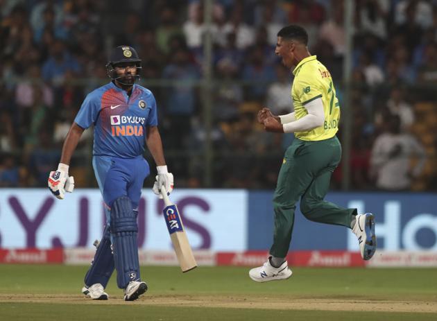 Beuran Hendricks, right, celebrates the dismissal of India's Rohit Sharma. (AP)