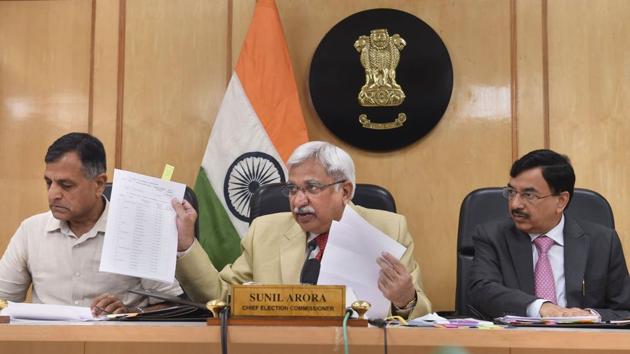 Chief Election Commissioner Sunil Arora flanked by Election Commissioners Ashok Lavasa (L) and Sunil Chandra during a press conference regarding Maharashtra and Haryana Assembly Elections, at Election Commission, in New Delhi. (Shahbaz Khan / PTI) Chief Election Commissioner Sunil Arora flanked by Election Commissioners Ashok Lavasa (L) and Sunil Chandra during a press conference regarding Maharashtra and Haryana Assembly Elections, at Election Commission, in New Delhi. (Shahbaz Khan / PTI)