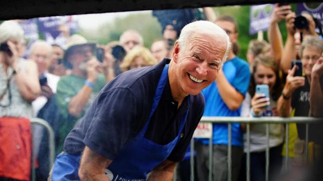 Joe Biden, former US vice president and Democratic presidential hopeful, leans down and smiles for the media while frying steaks at the Polk County Democrats' Steak Fry in Des Moines, Iowa. (REUTERS) Joe Biden, former US vice president and Democratic presidential hopeful, leans down and smiles for the media while frying steaks at the Polk County Democrats' Steak Fry in Des Moines, Iowa. (REUTERS)