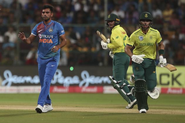 India's Deepak Chahar, left, reacts as South Africa's Reeza Hendricks, right, and captain Quinton de Kock run between the wickets. (AP)