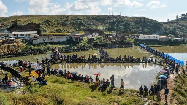 Khasi men fish at a pond during a fishing competition near Weilei village, in Meghalaya. (Diptendu Dutta / AFP) Khasi men fish at a pond during a fishing competition near Weilei village, in Meghalaya. (Diptendu Dutta / AFP)