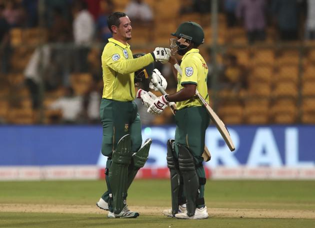 South Africa's captain Quinton de Kock, left, celebrates with his batting partner Temba Bavuma after their win in the third T20I. (AP)