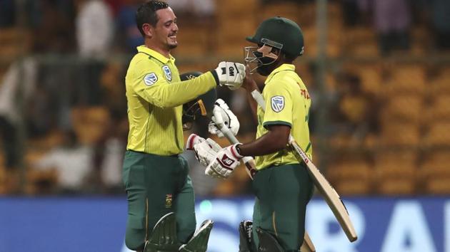 South Africa's captain Quinton de Kock, left, celebrates with his batting partner Temba Bavuma.(AP)