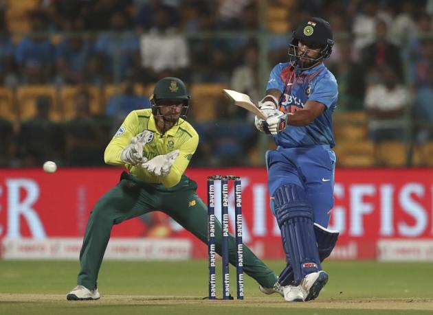 Shikhar Dhawan, right, plays a shot during the third and last T20 cricket match between India and South Africa. (AP)