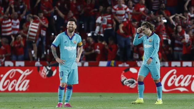 Barcelona's Messi, right, and Antoine Griezmann react.(AP)