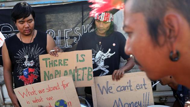 A punk group offers free food during a climate change demonstration in Yangon, Myanmar. (REUTERS) A punk group offers free food during a climate change demonstration in Yangon, Myanmar. (REUTERS)