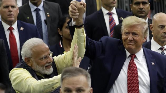 President Donald Trump and Indian Prime Minister Narendra Modi walk around NRG Stadium waving to the crowd during the "Howdy Modi: Shared Dreams, Bright Futures" event, in Houston.(AP) President Donald Trump and Indian Prime Minister Narendra Modi walk around NRG Stadium waving to the crowd during the "Howdy Modi: Shared Dreams, Bright Futures" event, in Houston.(AP)