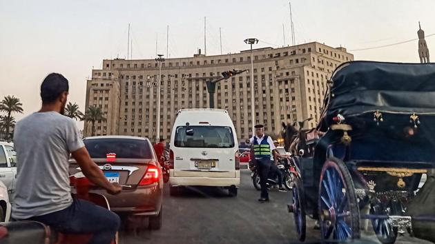 A policeman stops traffic in Cairo’s Tahrir Square. A heavy security presence was maintained in Tahrir Square, the epicentre of Egypt’s 2011 revolution, after protests in several cities called for the removal of general-turned-president Abdel Fattah al-Sisi.Such demonstrations are rare after Egypt effectively banned protests under a law passed following the 2013 military ouster of ex-president Mohamed Morsi. (Mohamed el-Shahed / AFP) A policeman stops traffic in Cairo’s Tahrir Square. A heavy security presence was maintained in Tahrir Square, the epicentre of Egypt’s 2011 revolution, after protests in several cities called for the removal of general-turned-president Abdel Fattah al-Sisi.Such demonstrations are rare after Egypt effectively banned protests under a law passed following the 2013 military ouster of ex-president Mohamed Morsi. (Mohamed el-Shahed / AFP)