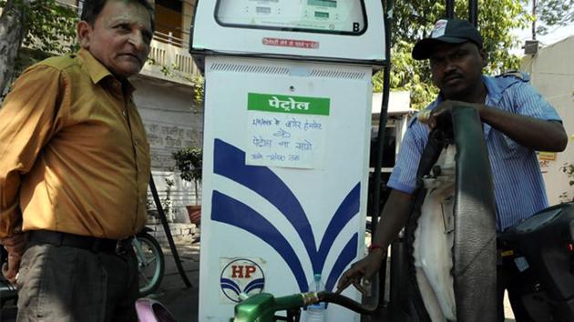 People fill up petrolat a fuel pump in New Delhi. (Arun Mondhe/HT photo) People fill up petrolat a fuel pump in New Delhi. (Arun Mondhe/HT photo)