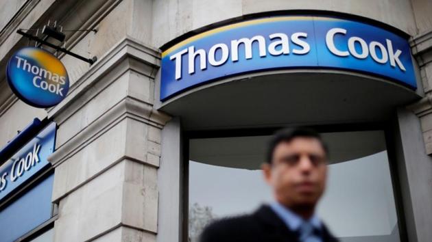 A pedestrian walks past a Thomas Cook shop in central London. (REUTERS) A pedestrian walks past a Thomas Cook shop in central London. (REUTERS)