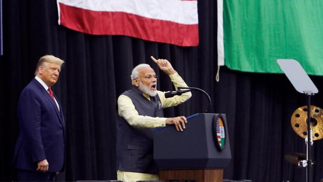 US President Donald Trump looks on as Indian Prime Minister Narendra Modi speaks during a "Howdy, Modi" rally at NRG Stadium in Houston, Texas. (REUTERS) US President Donald Trump looks on as Indian Prime Minister Narendra Modi speaks during a "Howdy, Modi" rally at NRG Stadium in Houston, Texas. (REUTERS)