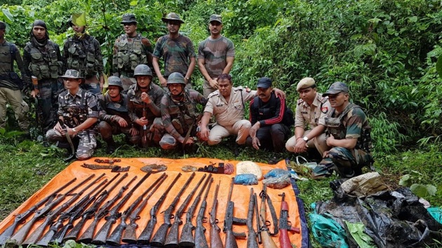 Security forces with the haul of seized arms and ammunition in Assam’s Manaas National Park near the Indo-Bhutan border. (HT PHOTO) Security forces with the haul of seized arms and ammunition in Assam’s Manaas National Park near the Indo-Bhutan border. (HT PHOTO)