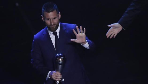 Argentinian Barcelona player Lionel Messi receives the Best FIFA mens player award during the ceremony(AP)